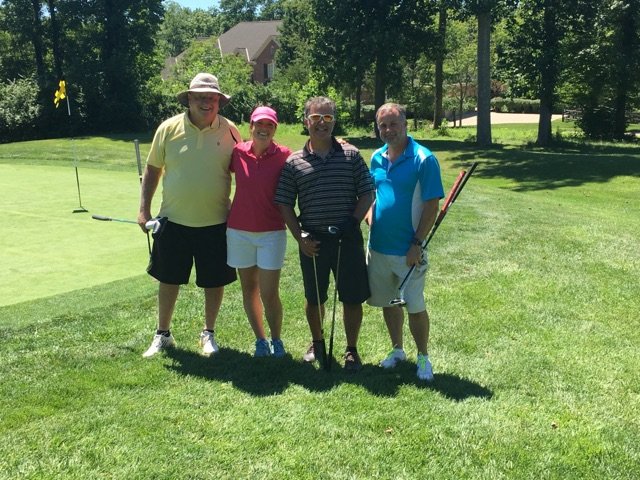 team playing at IKRON annual golf outing